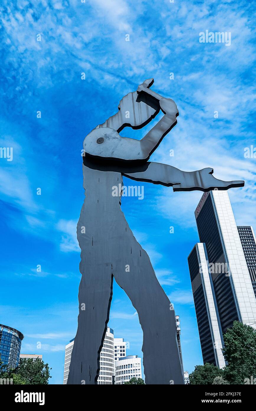 The Hammering Man high and heavy movable sculpture (a symbol of work, action and of solidarity with all people who work) in Frankfurt, Germany Stock Photo