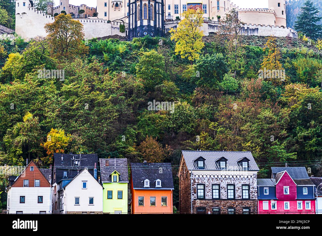 Picturesque houses below Stolzenfels Romantic Castle on the banks of the Rhine in Koblenz, Germany Stock Photo