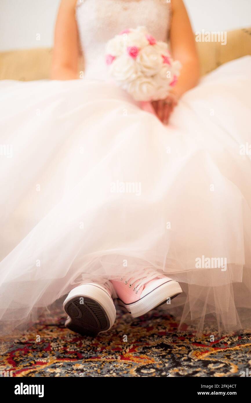 white wedding dress with pink shoes Dressed in white with a pop of pink! Who says brides can't rock hot pink shoes? Breaking traditions and slaying the game! @lgrahamphotography . . . . . . . #CentralTexasEngagement #CentralTexasEngaged #TexasEngagement #HillCountryEngagement