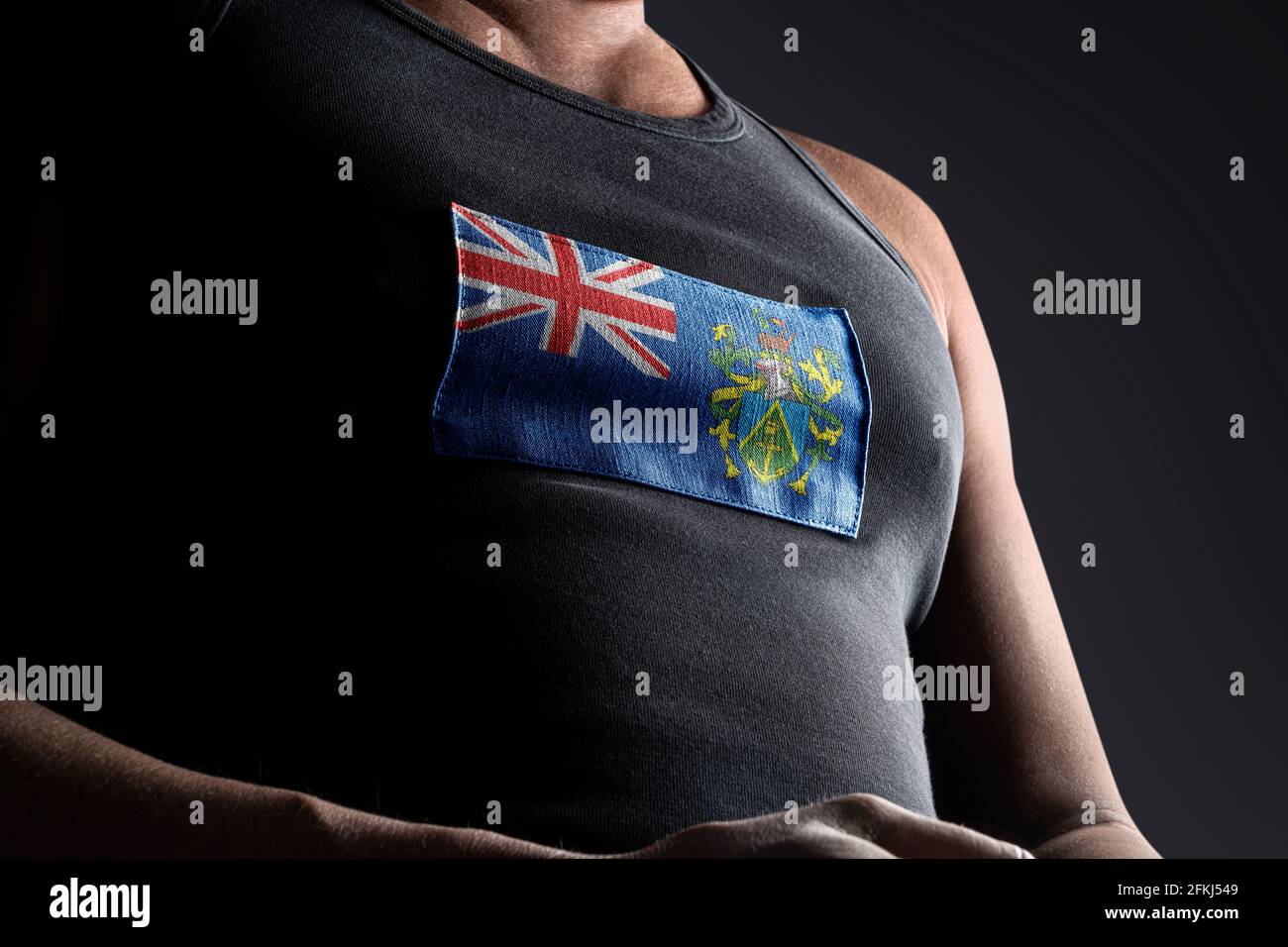 The national flag of Pitcairn Islands on the athlete's chest Stock Photo