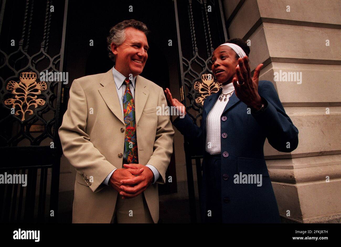 Cheryl Carolus August 1999the South African High Commissioner greeting Peter Haynes former anti apartheid campaigner now  now foreighn office minister outside the South African Embassy Stock Photo