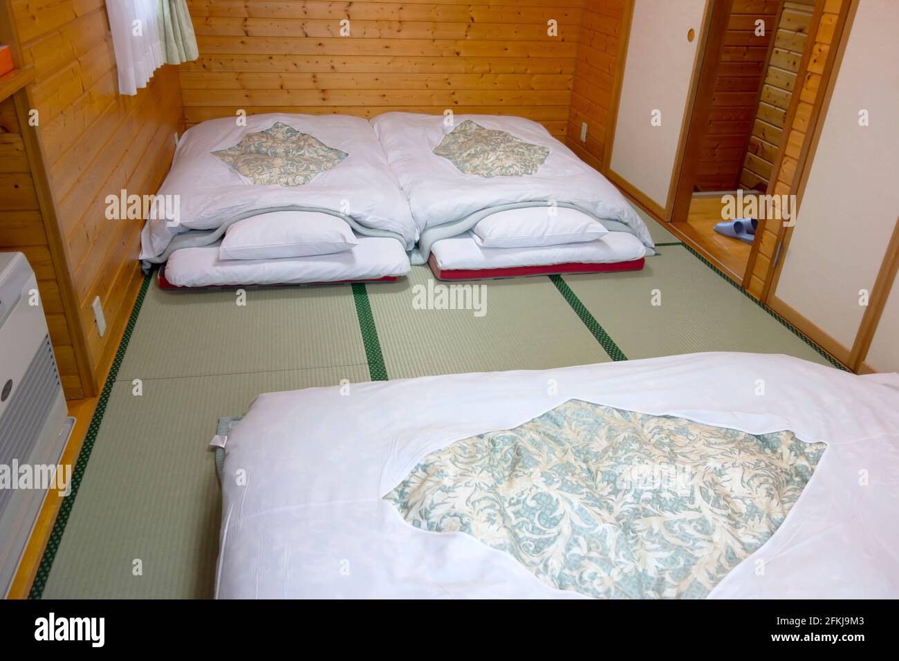 Japanese traditional bed on tatami mats Stock Photo Alamy
