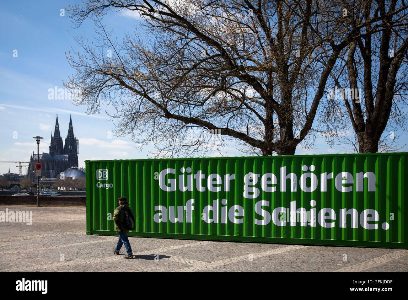 with a green freight container on the banks of the Rhine in Deutz, DB Cargo draws attention to the potential of CO2 reduction through transport by rai Stock Photo