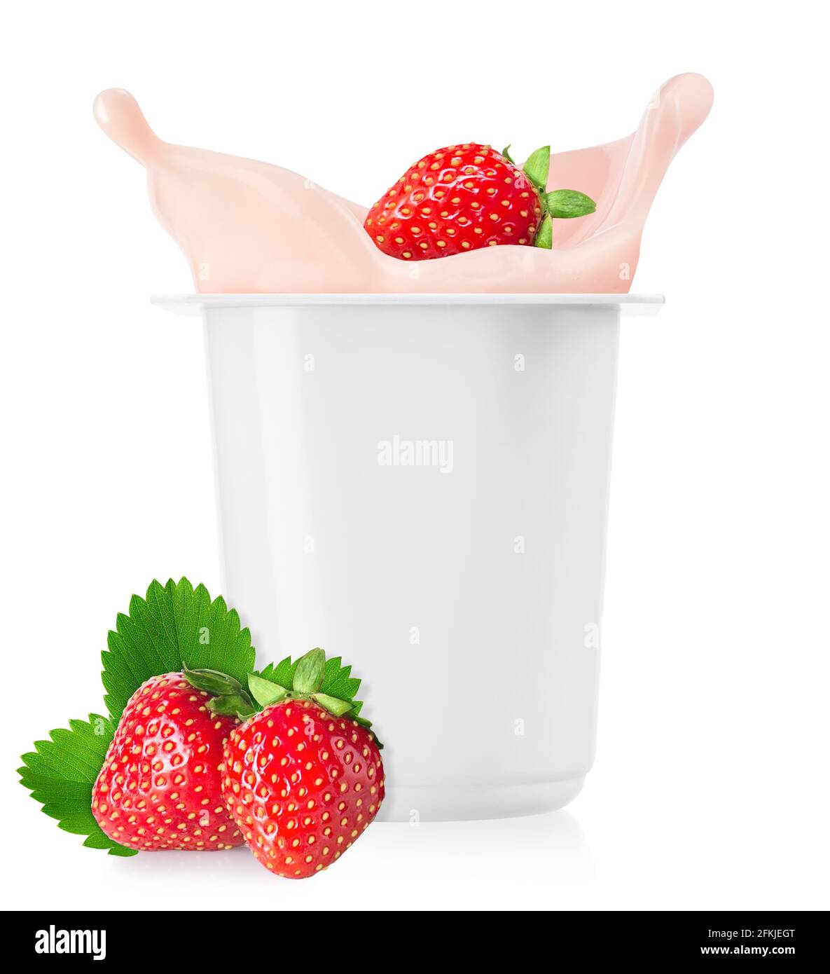 strawberry falling in plastic cup with yogurt Stock Photo