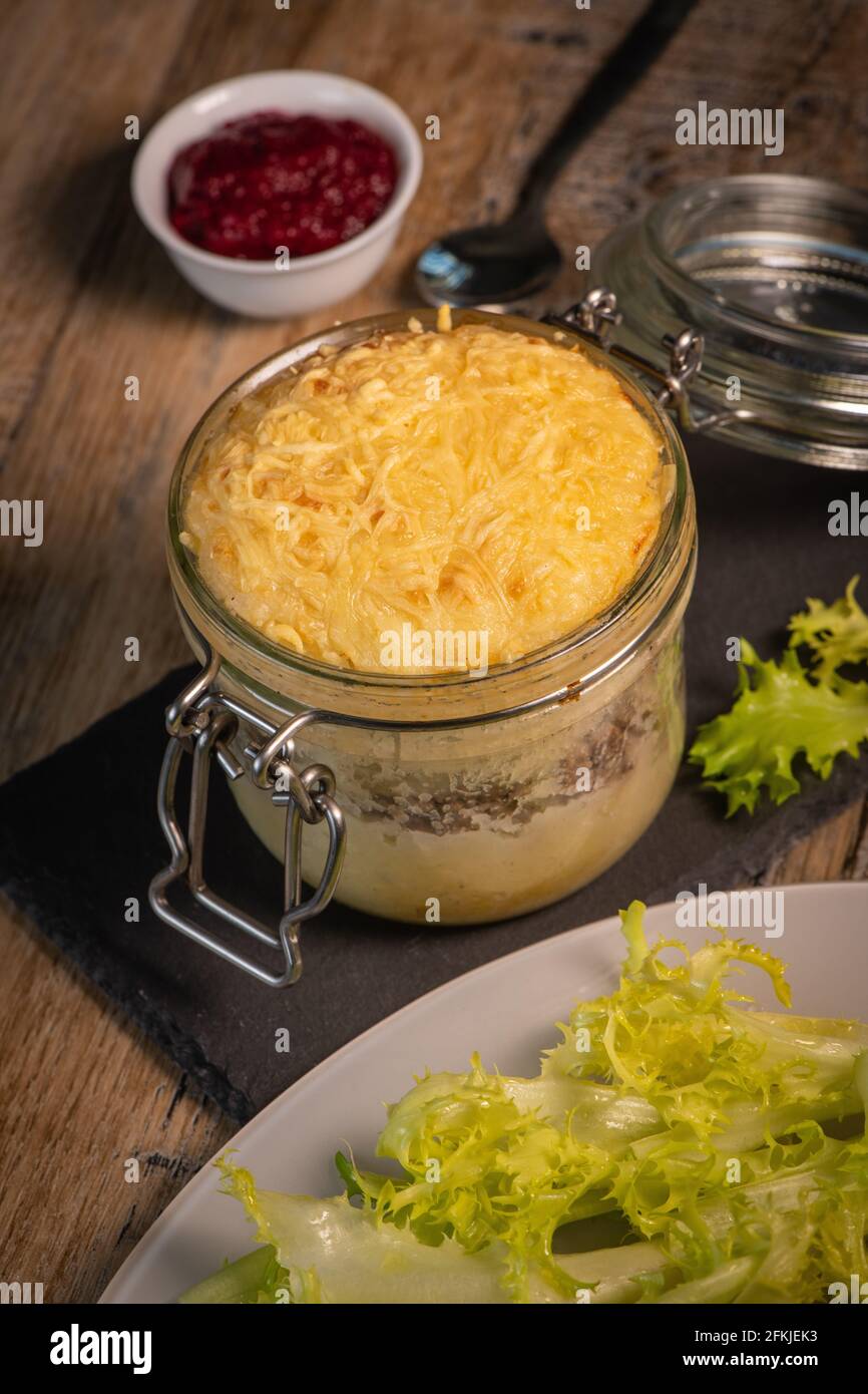 Beef pie recipe with red beet sauce cooked with chili spices and salad