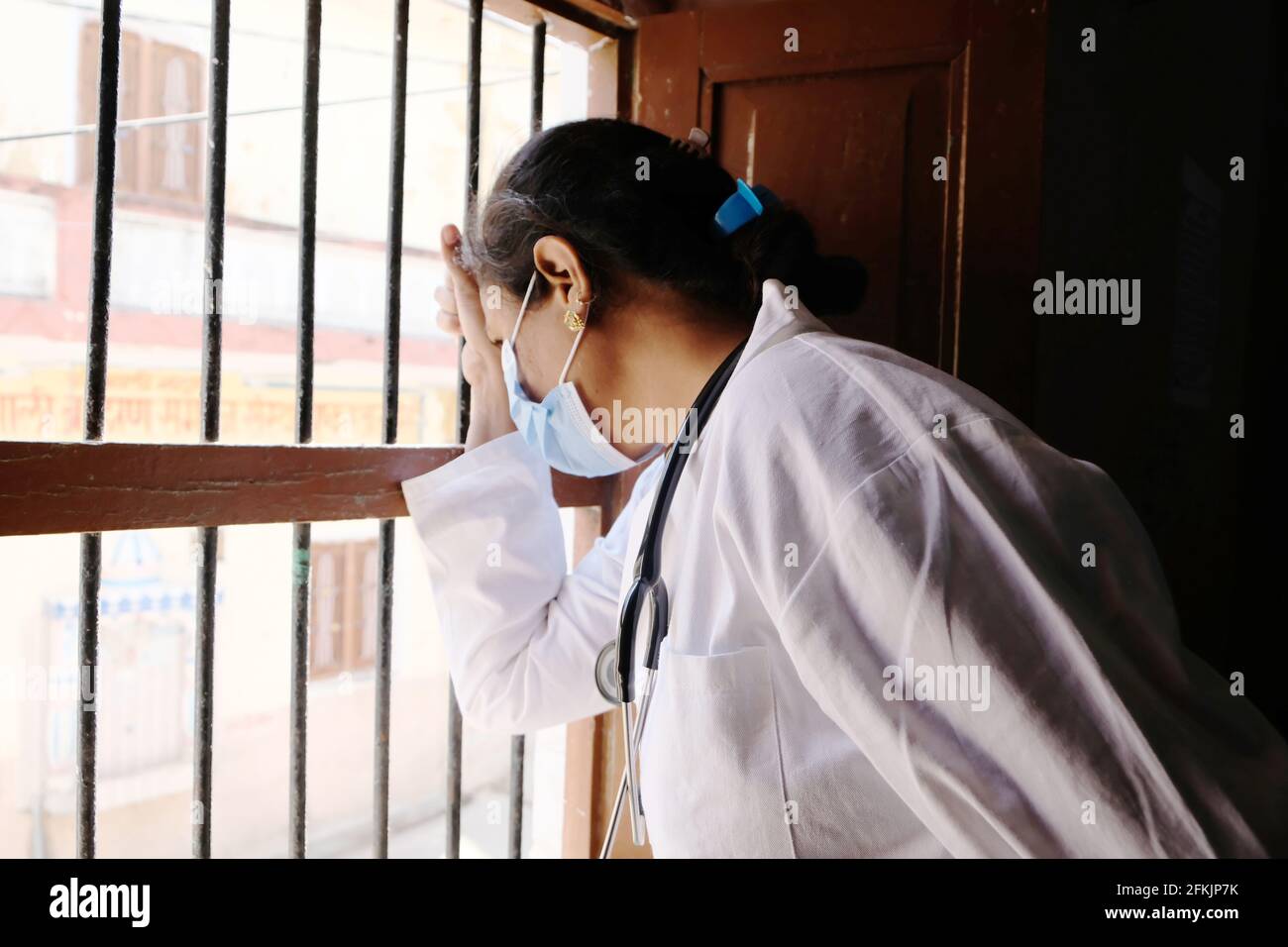An Indian female doctor exhausted after treating patients Stock Photo ...