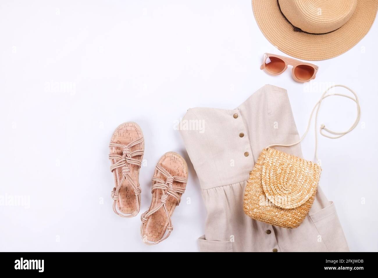 Woman clothes and accessories: beige strapless dress, hipster chic style boho aluminum earrings, casual rope sandals, brown sunglasses eyewear, stylis Stock Photo - Alamy Woman clothes and accessories: beige strapless dress, hipster chic style boho aluminum earrings, casual rope sandals, brown sunglasses eyewear, stylis Stock Photo - Alamy
