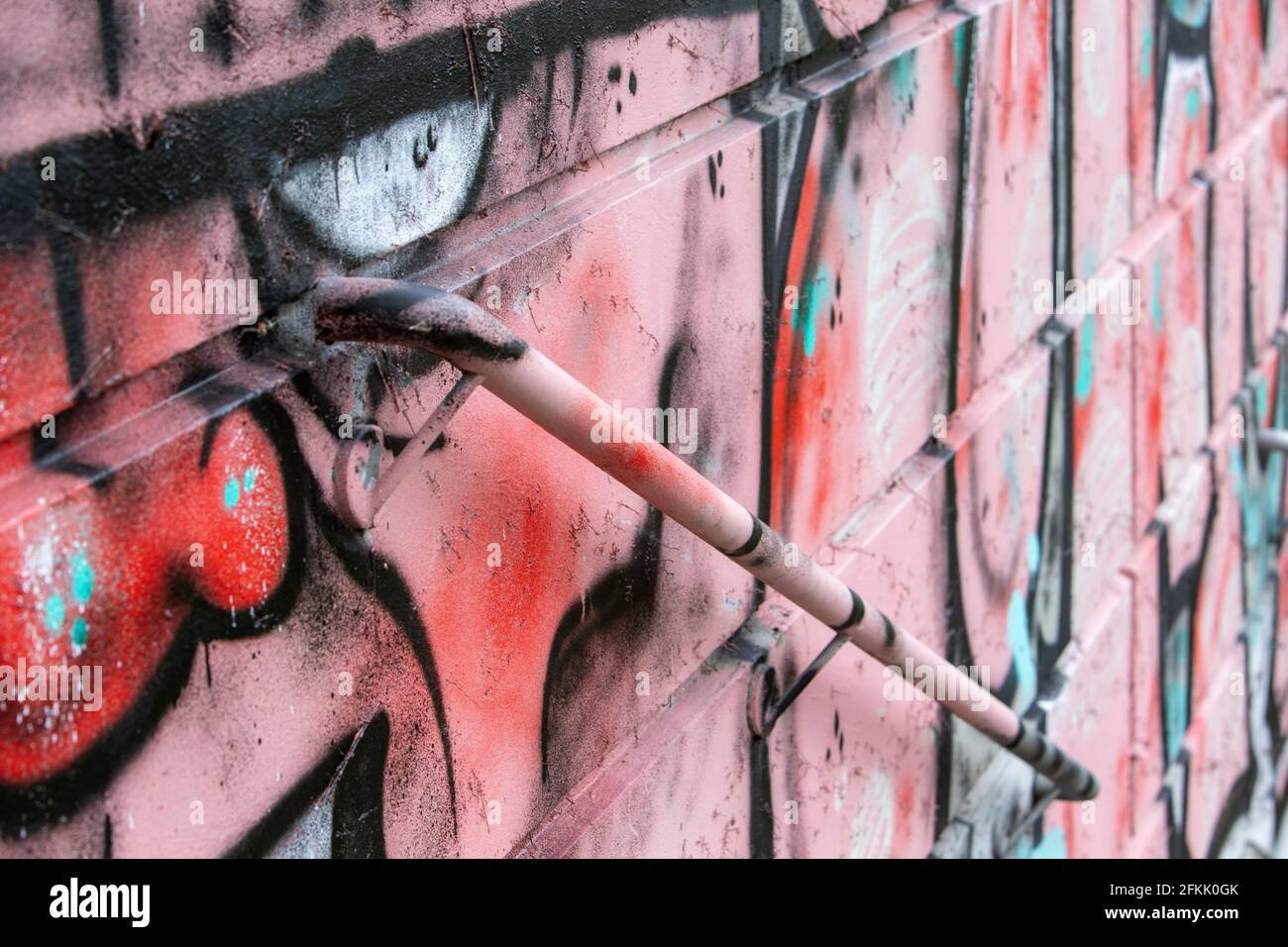 graffiti on a wall with a handrail Stock Photo
