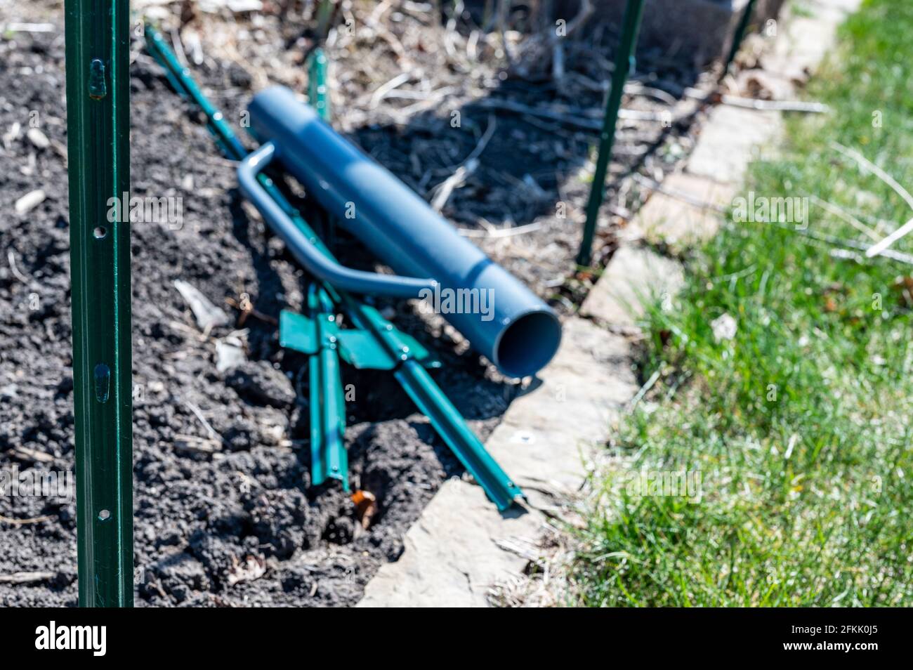 Manual fence post driver that is used by placing over a metal rod and