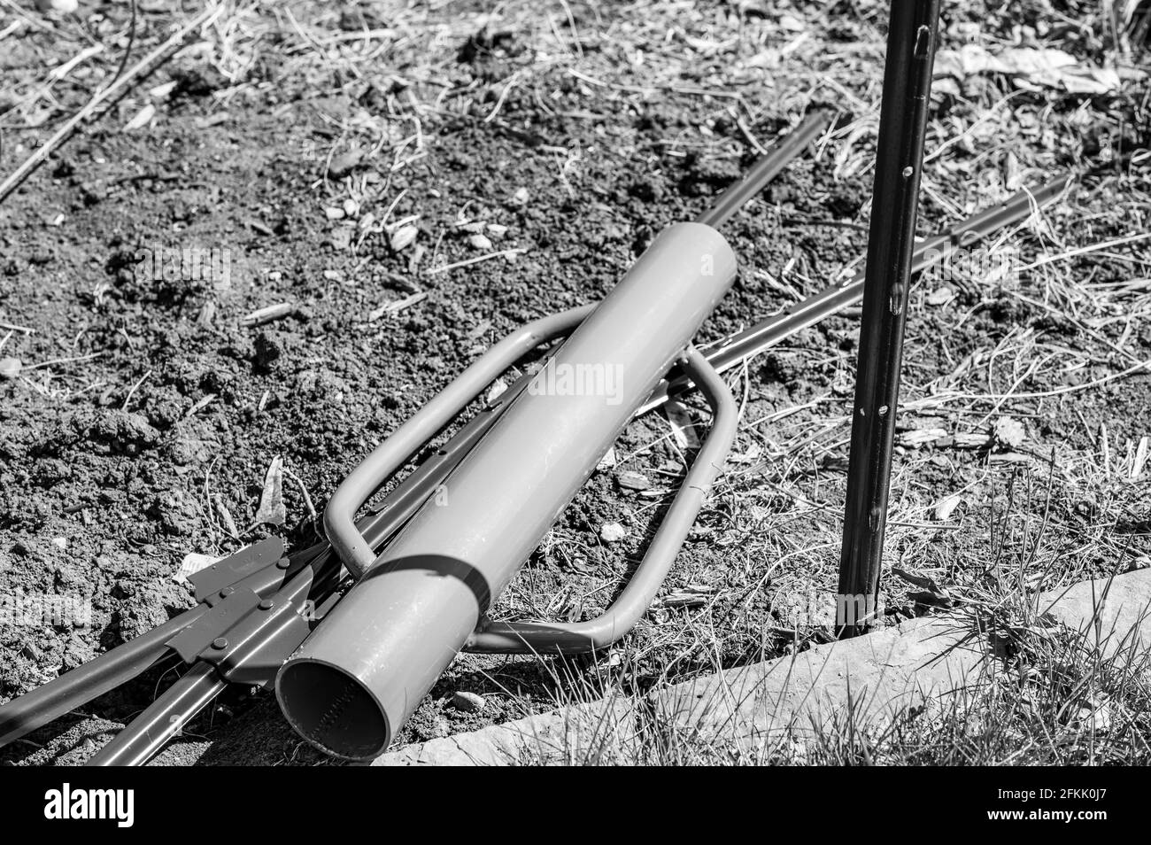 Manual fence post driver that is used by placing over a metal rod and