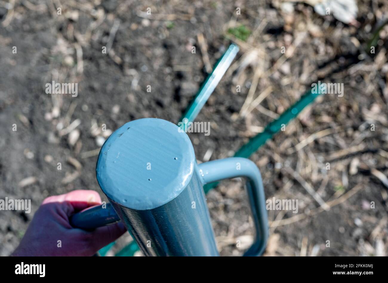 Manual fence post driver that is used by placing over a metal rod and