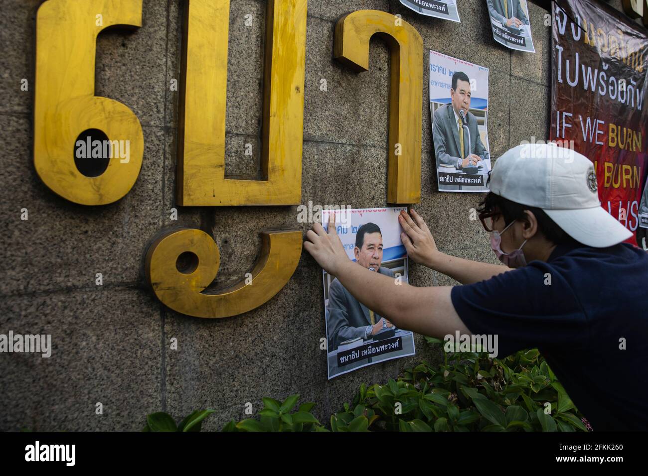 Protester stick portraits of Chanatip Muanpawong, the presiding judge who denied bail requests for detained pro-democracy leaders and other political prisoners who accused under lese majeste law during the demonstration.The pro-democracy protesters led by “REDEM” group gather at the Victory Monument before going by vehicle to the Criminal Court of Thailand to demand the release of detained pro-democracy activists who were detained by the lese majeste law (article 112 of the Thai criminal code). (Photo by Varuth Pongsapipatt/SOPA Images/Sipa USA) Stock Photo