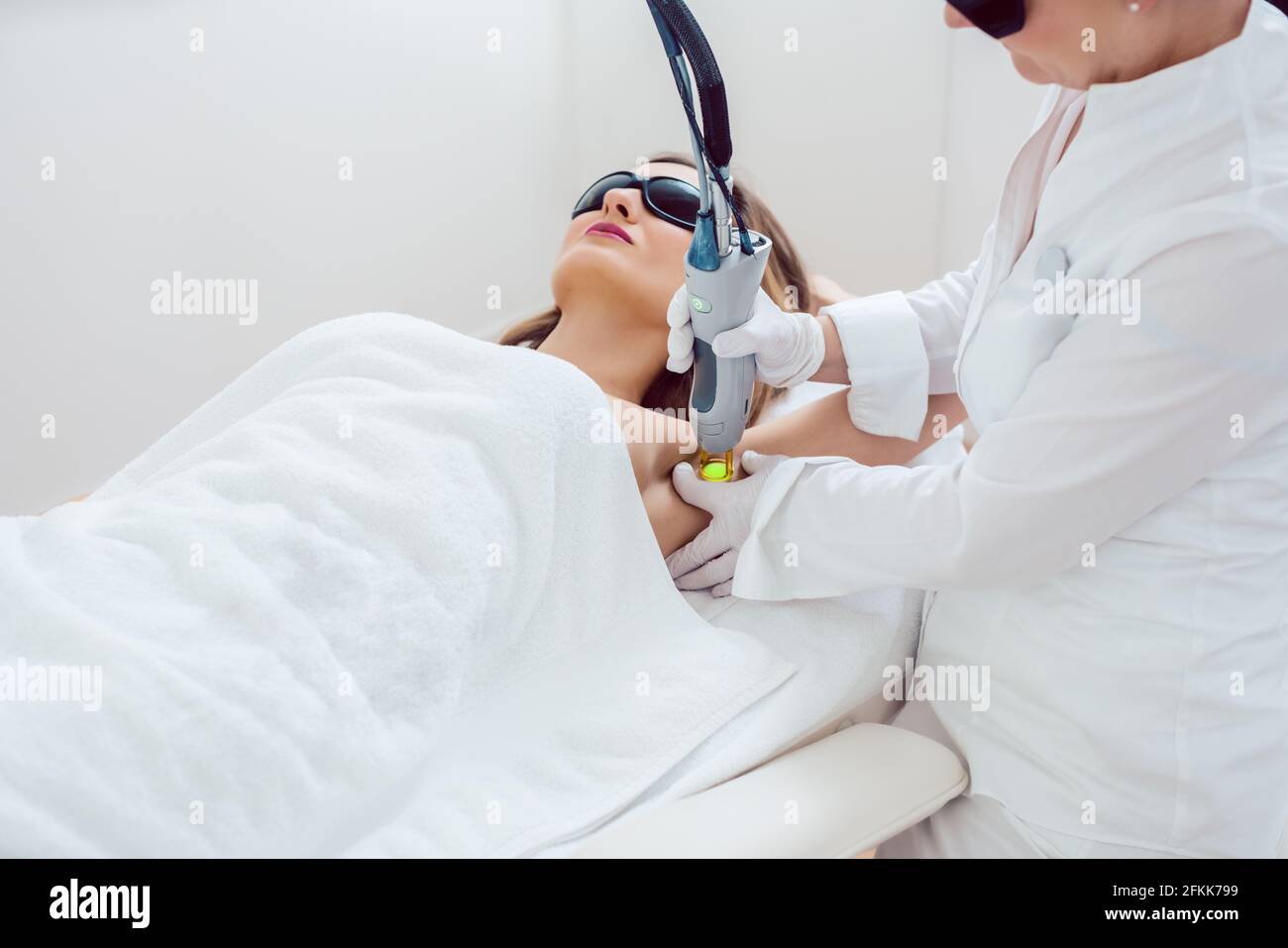 Woman during hair removal using modern laser technology Stock Photo Alamy