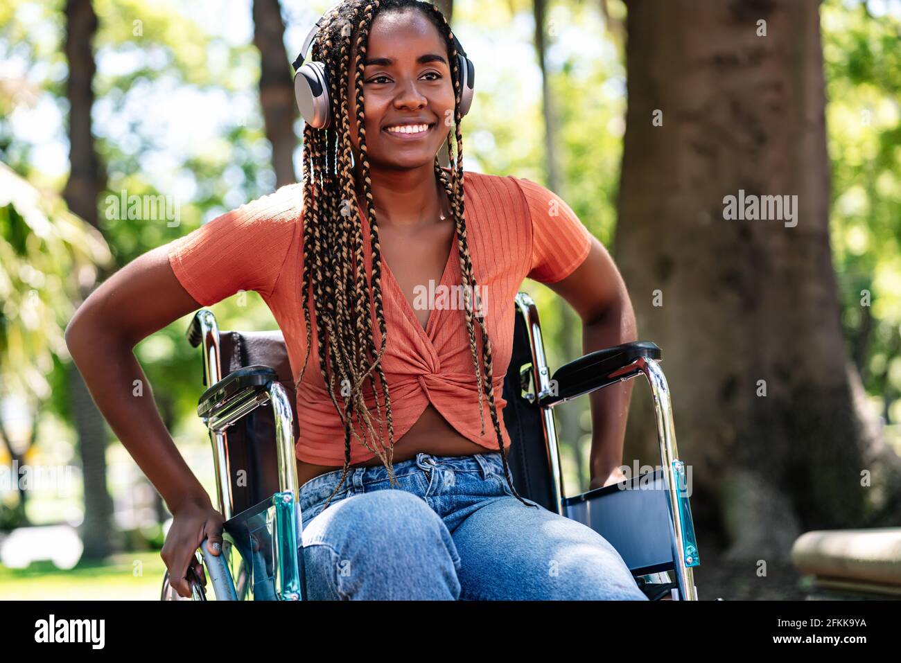 Woman in wheelchair enjoying music hi-res stock photography and images ...