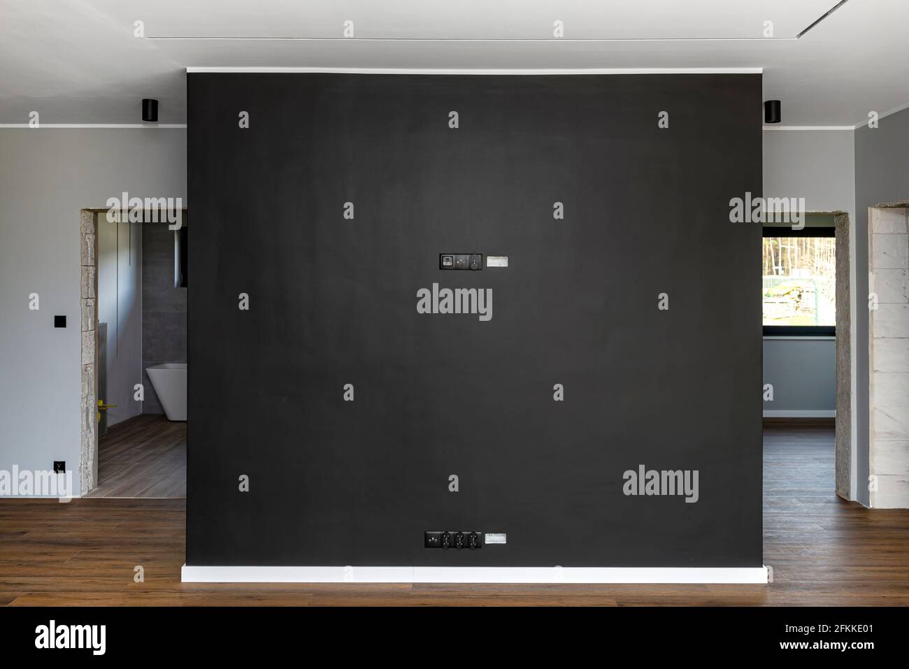 Black mat TV wall in the living room with electrical, antenna and TV