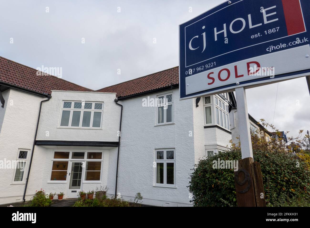 For Sale / Sold sign outside white detached house, Henleaze, Bristol