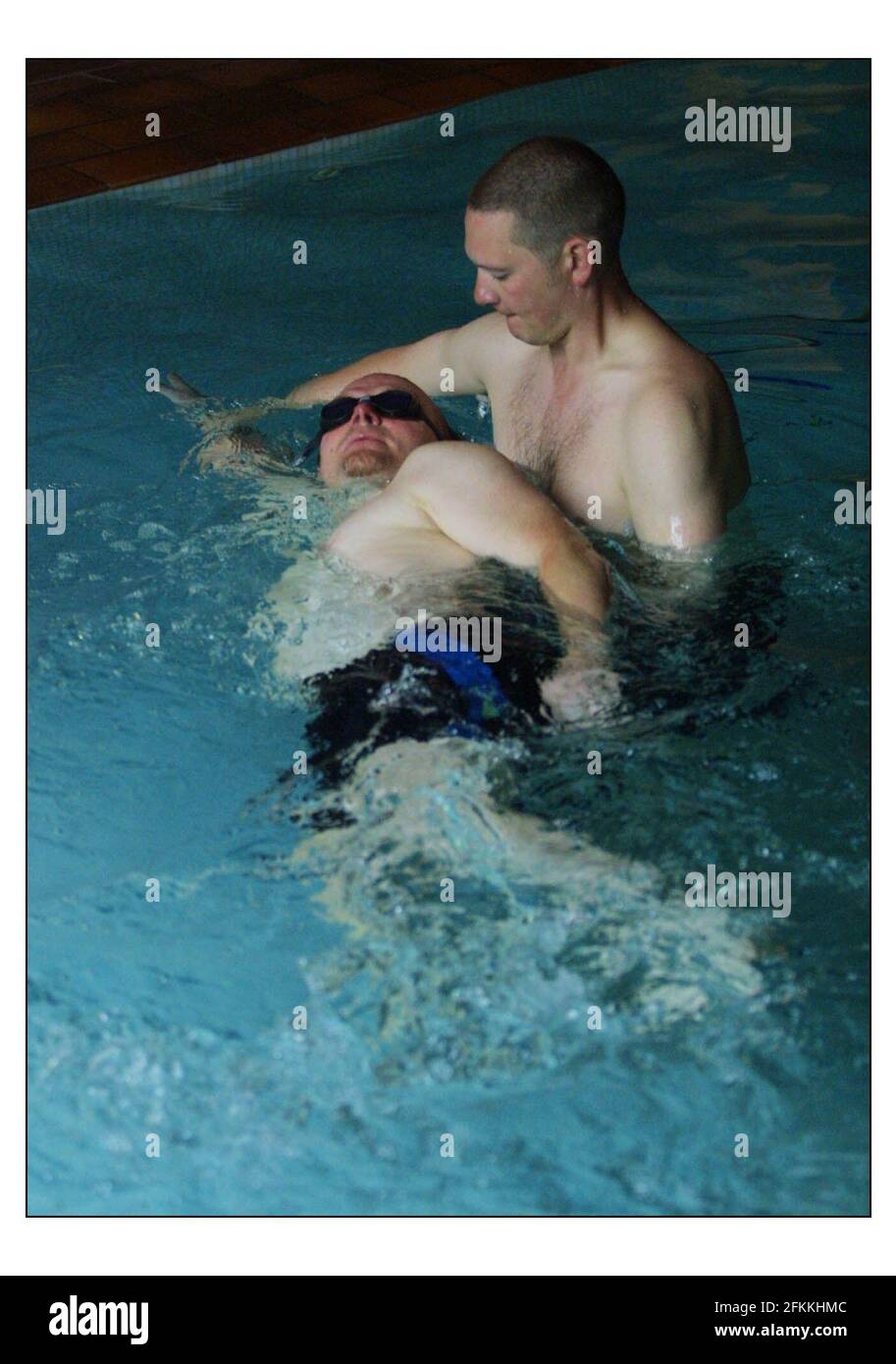 Pete Chapman receives swiming instruction from Swimming without Stress instructor Ian Cross.pic David Sandison 19/6/2003 Stock Photo