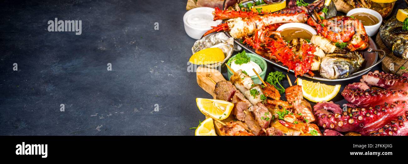 Assortment various barbecue Mediterranean grill food - fish, octopus, shrimp, crab, seafood, mussels, summer diet bbq party fest, with kebab, sauces, Stock Photo