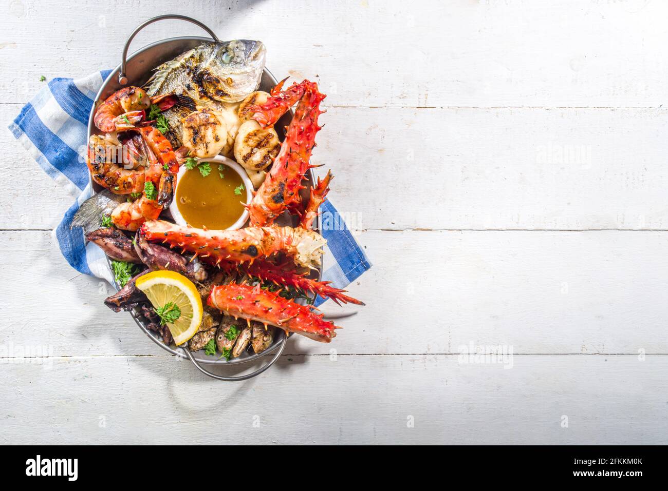 Assortment various barbecue Mediterranean grill food - fish, octopus, shrimp, crab, seafood, mussels, summer diet bbq party fest, with kebab, sauces, Stock Photo