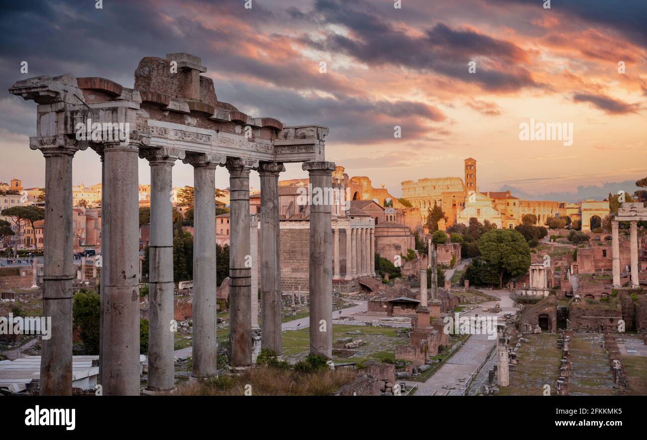 Rome, Italy. Ruins of the ancient roman forum at Palatino hill, Scenic urban landscape in the evening, cloudy sky at sunset. Roma top landmark and tou Stock Photo
