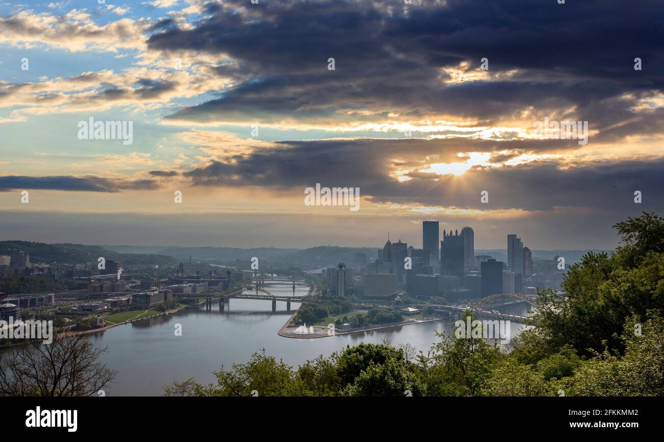 Pittsburgh Pennsylvania US of America, Pittsburgh city downtown aerial view from Point of view park, cloudy sky at sunset Stock Photo