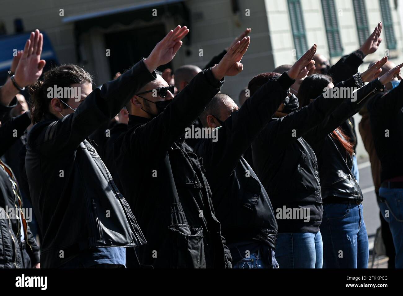 Dongo, Italy. 02nd May, 2021. Far right supporters make the roman salute to commemorate the death of Benito Mussolini and his mistress Claretta Petacci and other fascist leaders in Dongo, Italy on 2 May 2021 Credit: Piero Cruciatti/Alamy Live News Stock Photo
