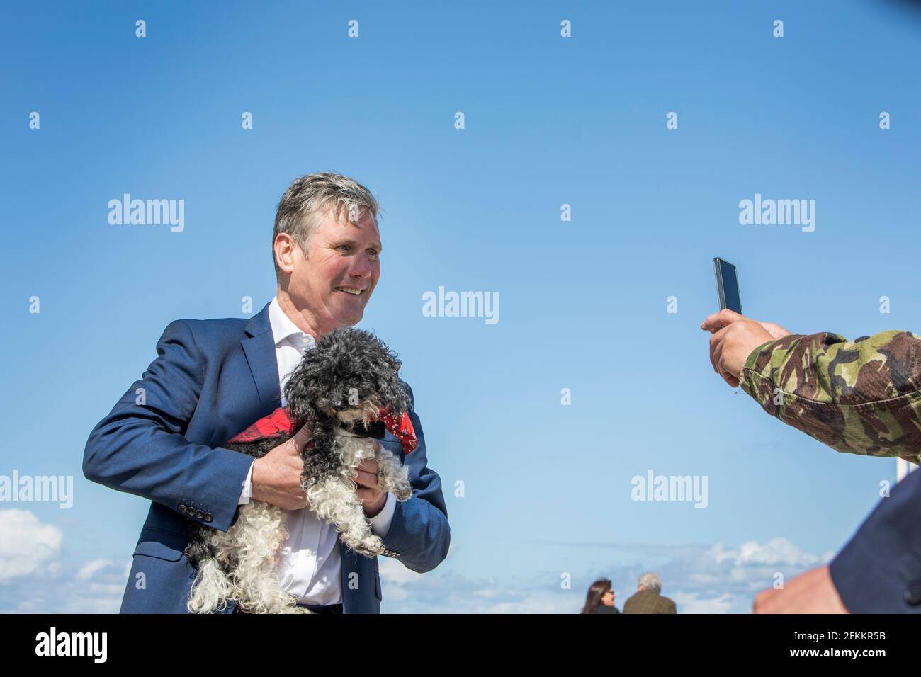 Sir Keir Starmer and Labour Candidate Dr Paul Williams canvassing with Angela Rayner MP during the Hartlepool Bye Election in Seaton Carew.  Sir Keir is holding Tommy Arnells dog 'Stig'. Stock Photo