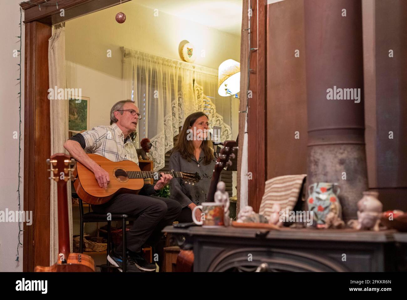Detroit, Michigan - Bob O'Brien and Julie Beutel perform a home concert by Zoom during the coronavirus pandemic. People could watch the concert for fr Stock Photo