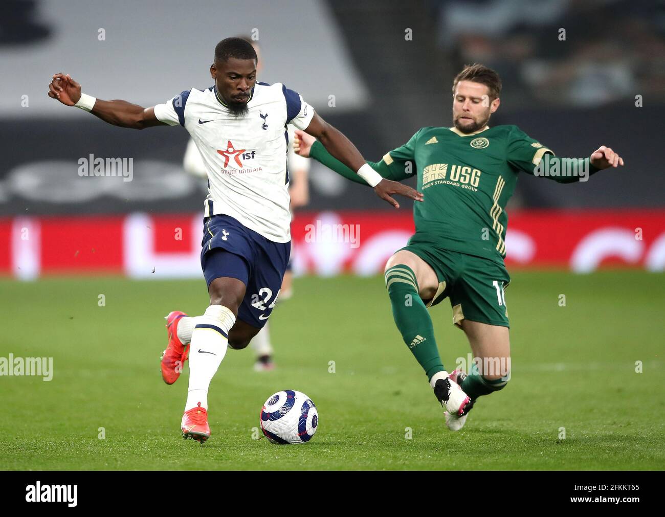 Tottenham Hotspur's Serge Aurier (left) and Sheffield United's Oliver Norwood battle for the ball during the Premier League match at the Tottenham Hotspur Stadium, London. Issue date: Sunday May 2, 2021. Stock Photo