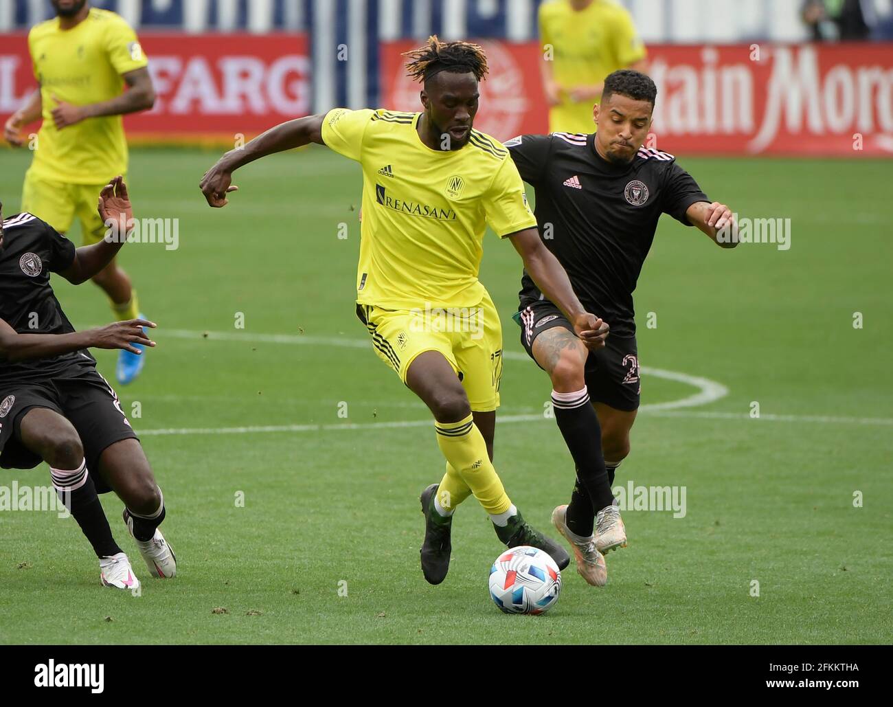 May 2, 2021: Nashville SC forward Charles Sapong (17) dribbles as Inter Miami CF midfielder Gregore (26) chases during the second half of an MLS game between the Inter Miami CF and the Nashville SC at Nissan Stadium in Nashville TN (Mandatory Photo Credit: Steve Roberts/CSM) Stock Photo