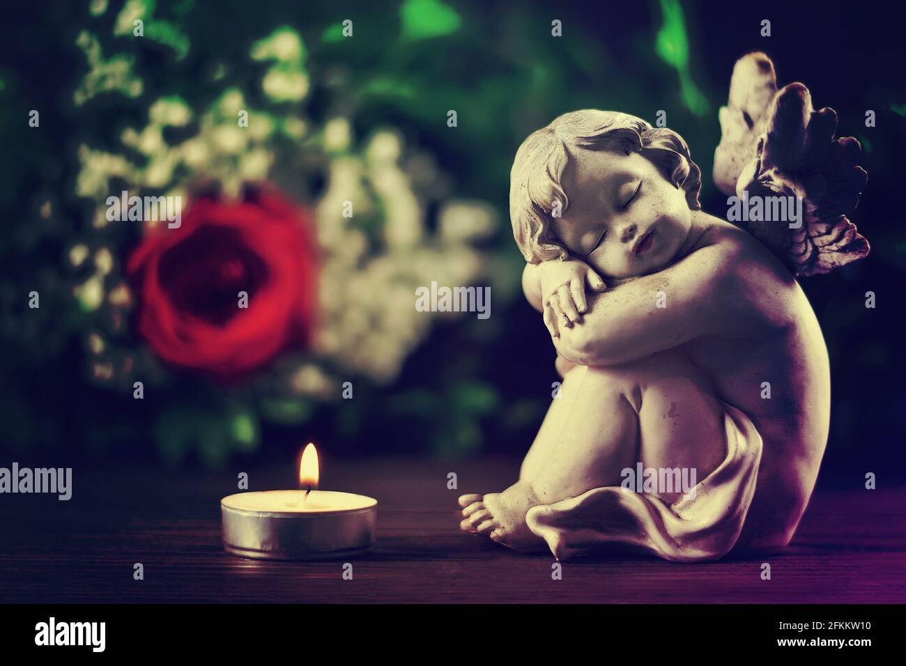 Condolence card with sleeping angel and burning candle Stock Photo Alamy