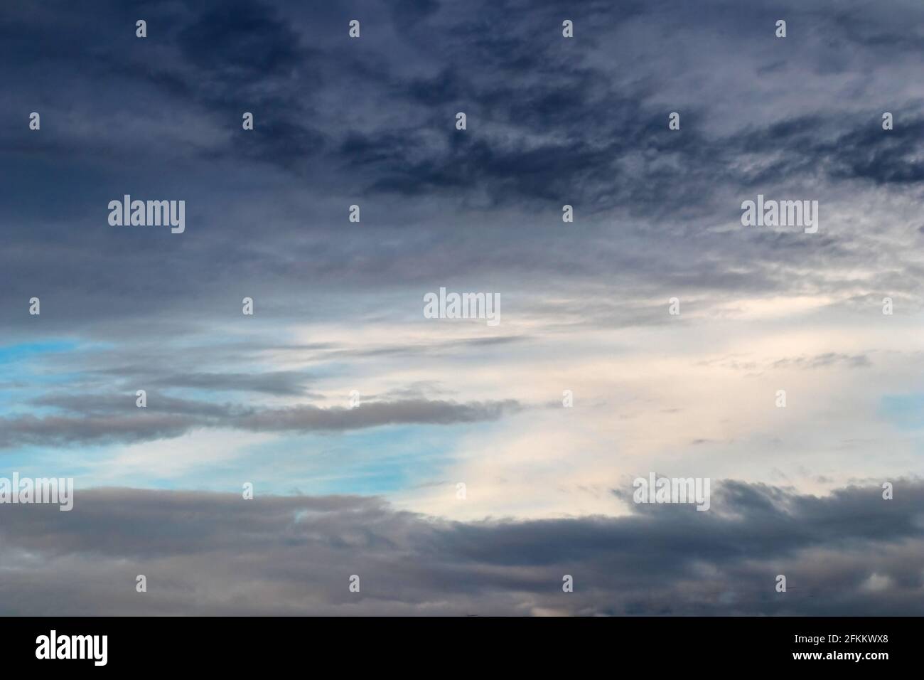 Storm Clouds reveals electric blue sky replacement Stock Photo Alamy