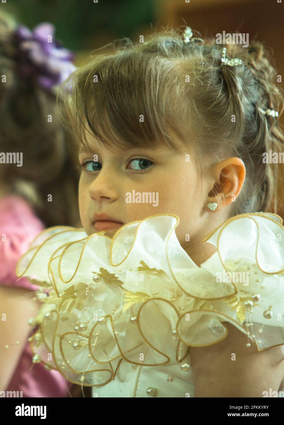 Portrait of little girl in an elegant dress Stock Photo - Alamy