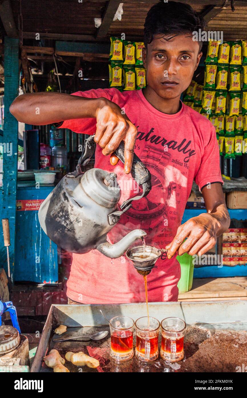 PAHARPUR, BANGLADESH - NOVEMBER 6, 2016: Tea seller at the local market in Paharpur village, Bangladesh Stock Photo