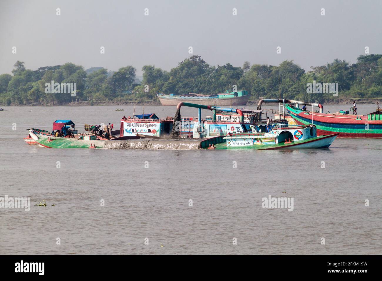 RUPSA, BANGLADESH - NOVEMBER 13, 2016: River sand mining dredgers on Rupsa river, Bangladesh Stock Photo