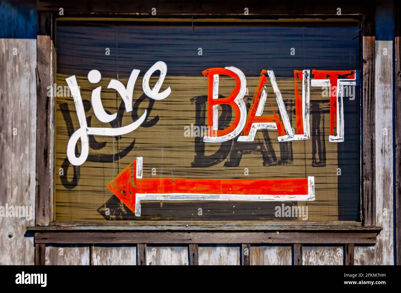 A window advertises live bait at a bait shop overlooking the Escatawpa