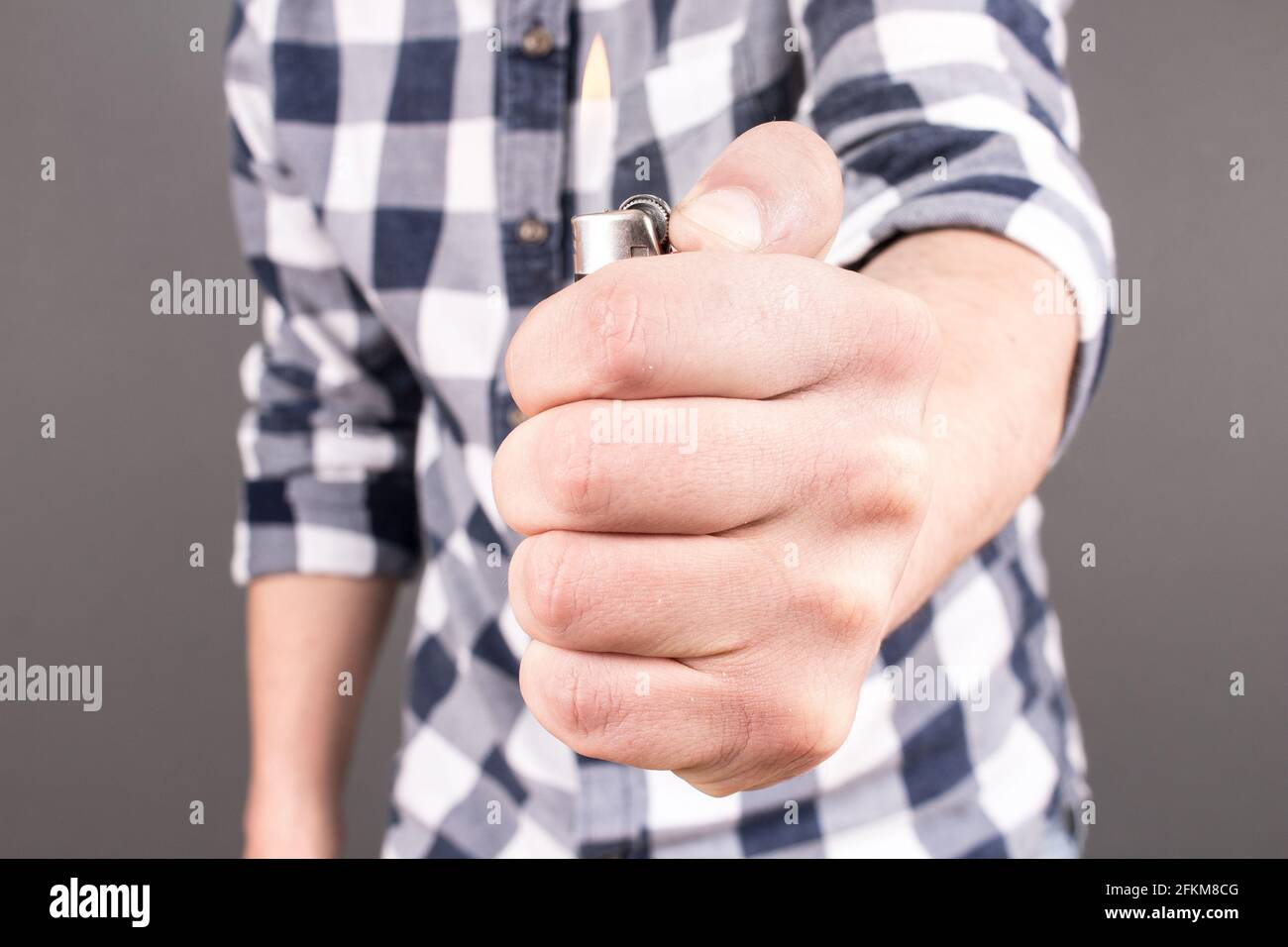 Man holding lighter Stock Photo Alamy