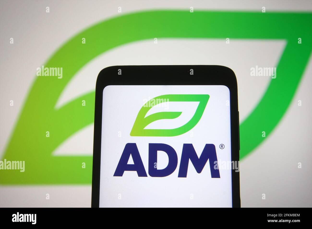 In this photo illustration an ADM (ArcherDanielsMidland Company) logo is seen on a smartphone