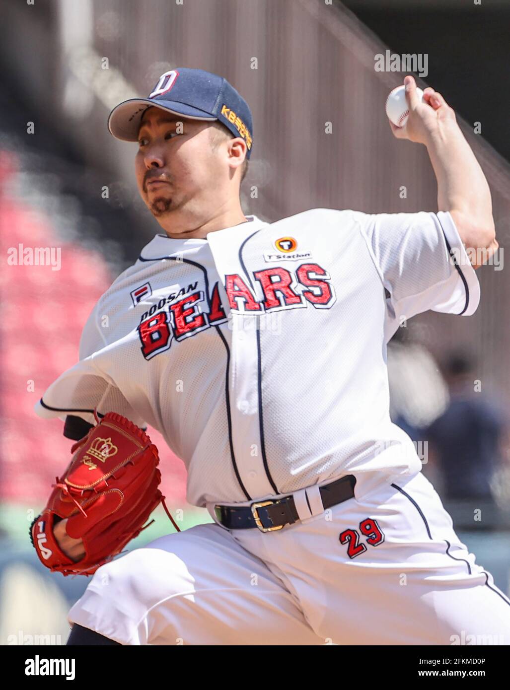 Outfielder Kim In-Tae of Doosan Bears scores a run into the home