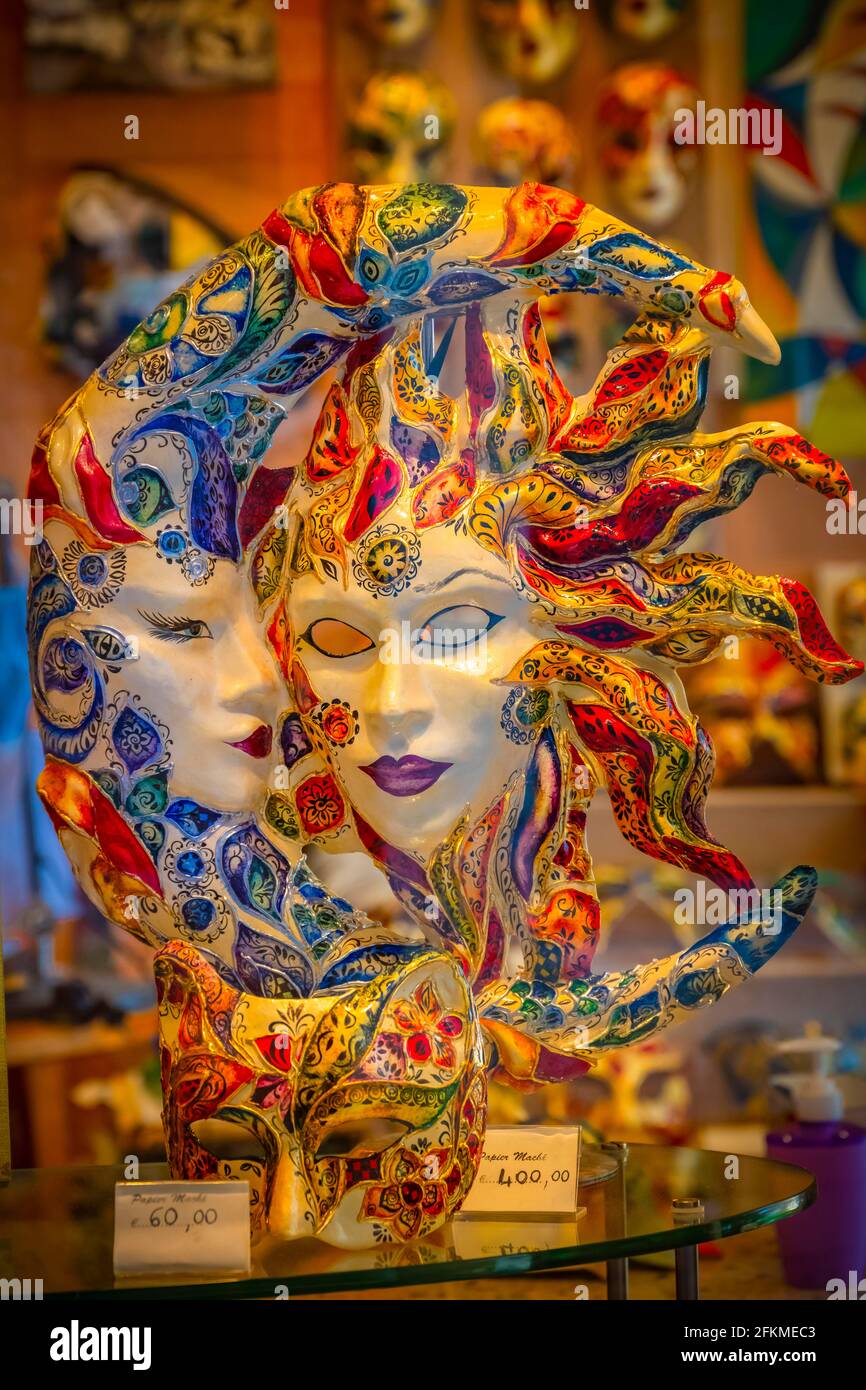 Venetian carnival masks in a shop window, Venice, Veneto, Italy Stock Photo