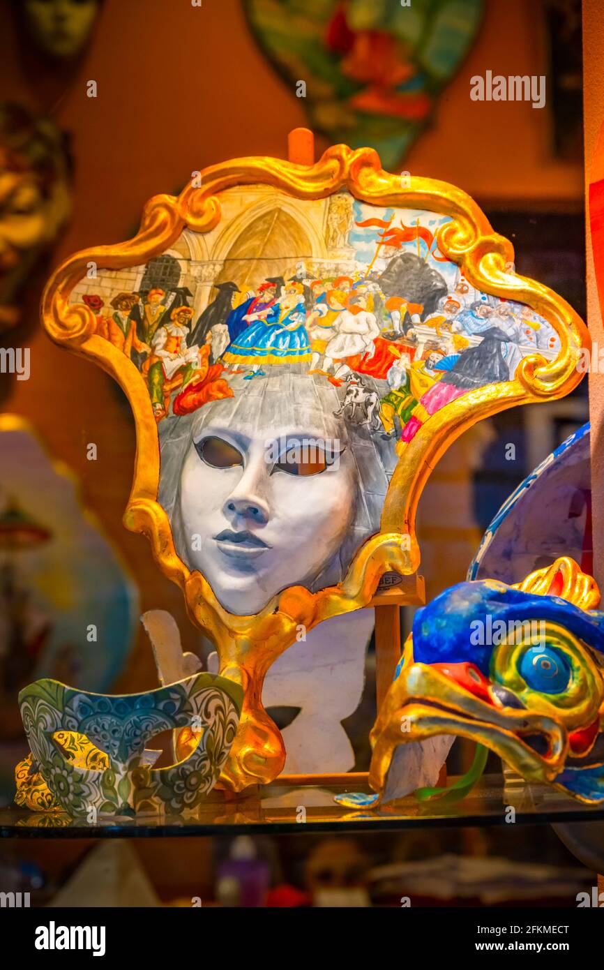 Venetian carnival masks in a shop window, Venice, Veneto, Italy Stock Photo