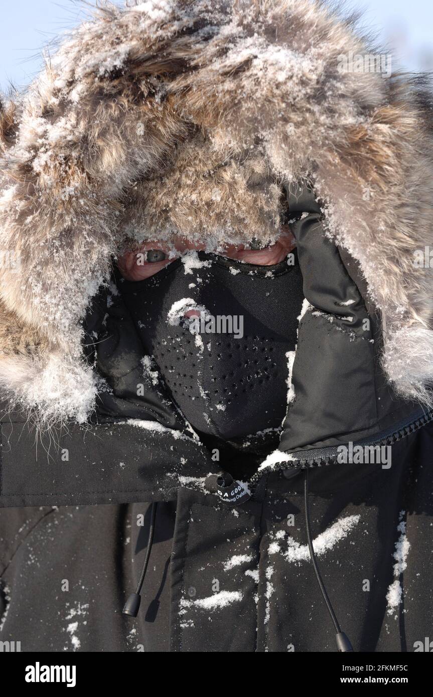 Man with winter clothing and face protection in extreme cold