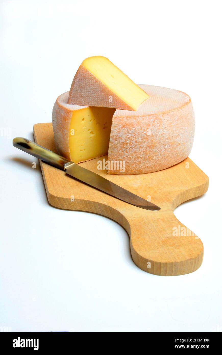 https://c8.alamy.com/comp/2FKMH0R/cheese-on-wooden-board-with-knife-alpine-cheese-aletsch-mutschli-semi-hard-cheese-cheese-wheel-2FKMH0R.jpg