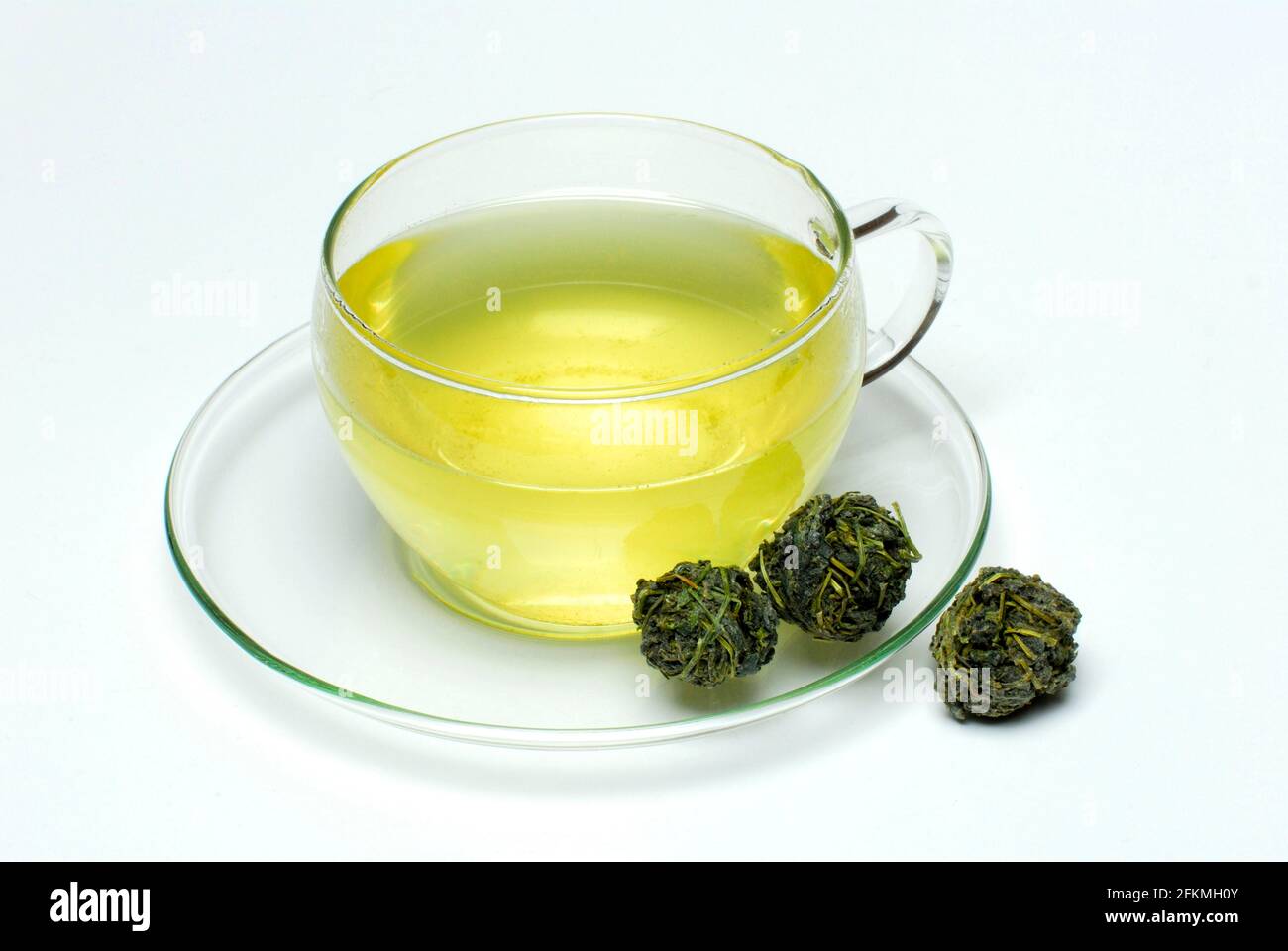 Cup of Jiaogulan tea, dried balls, , female ginseng (Gynostemma