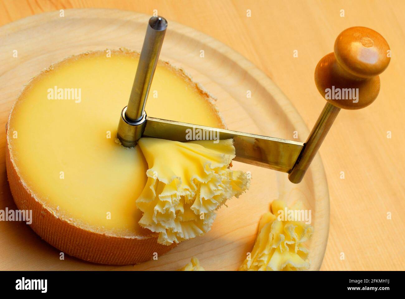 Cheese 'Tete de Moine' with rotating knife Girolle, cheese rosettes, monk's  head Stock Photo - Alamy