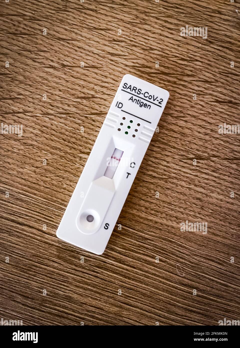 Close-up of a corona rapid test at home where you have the results after 15 minutes with the negative test result, happy to be not infected by the Stock Photo