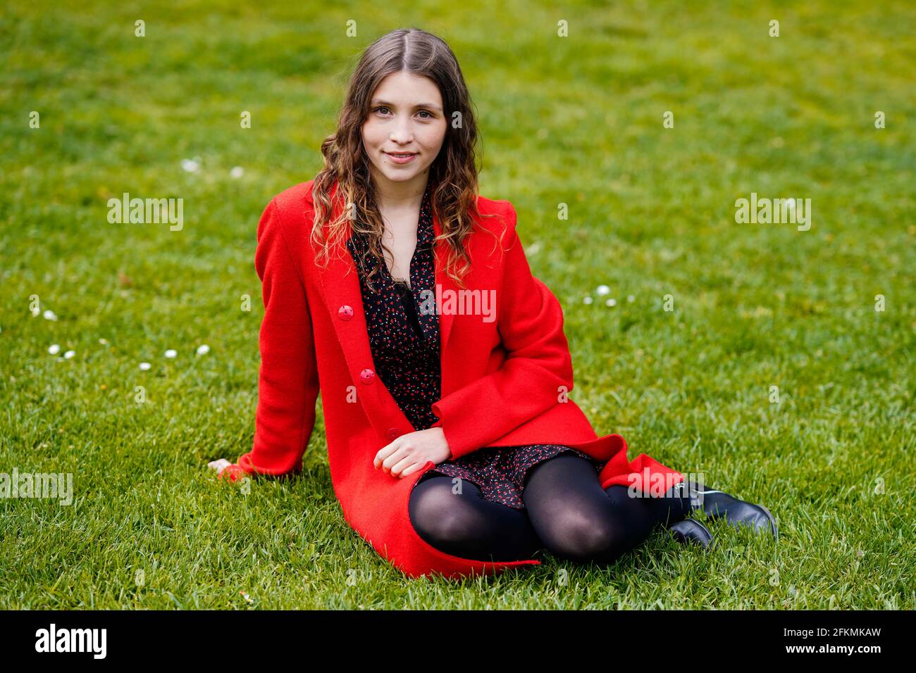 Speyer, Germany. 02nd May, 2021. Actress Janina Fautz sits on a lawn in a  downtown park. Credit: Uwe Anspach/dpa/Alamy Live News Stock Photo - Alamy