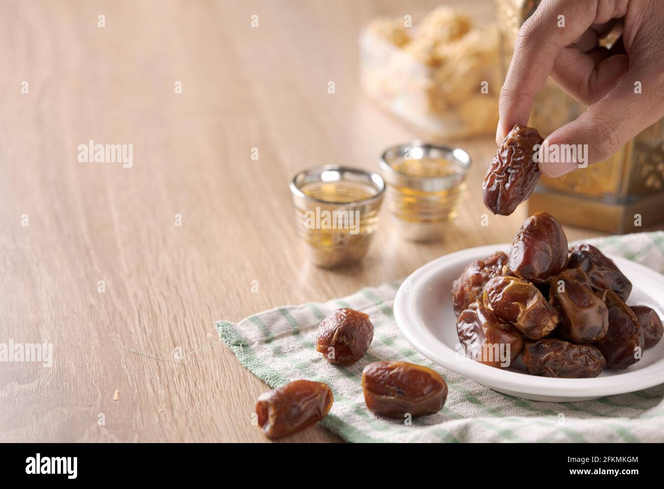 Eating dried dates.Traditional arabic food for iftar Stock Photo Alamy