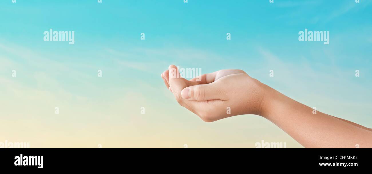 Hands reaching for the sky sunset background. Hope concept Stock Photo