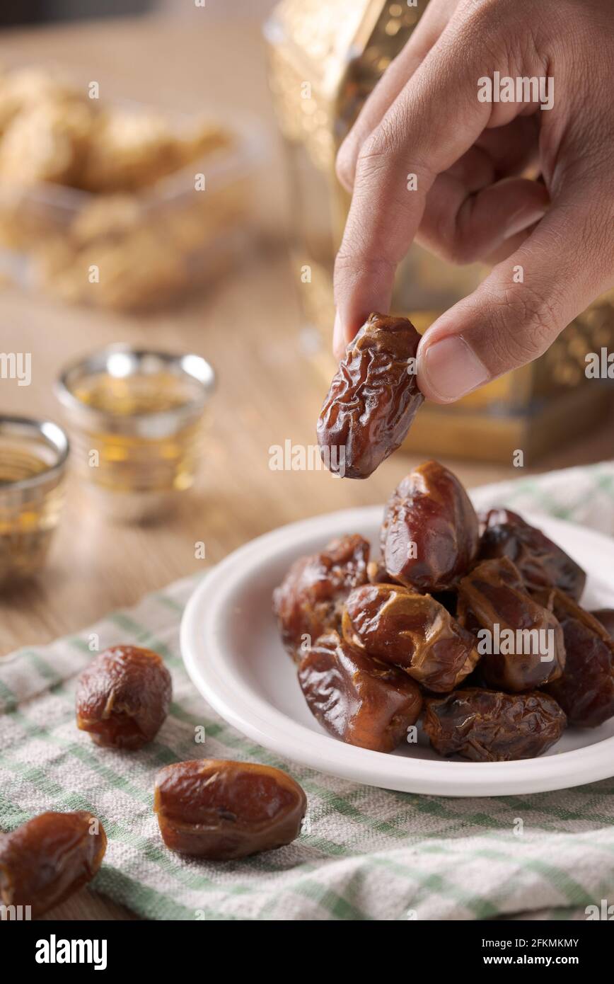 Eating dried dates.Traditional arabic food for iftar Stock Photo Alamy